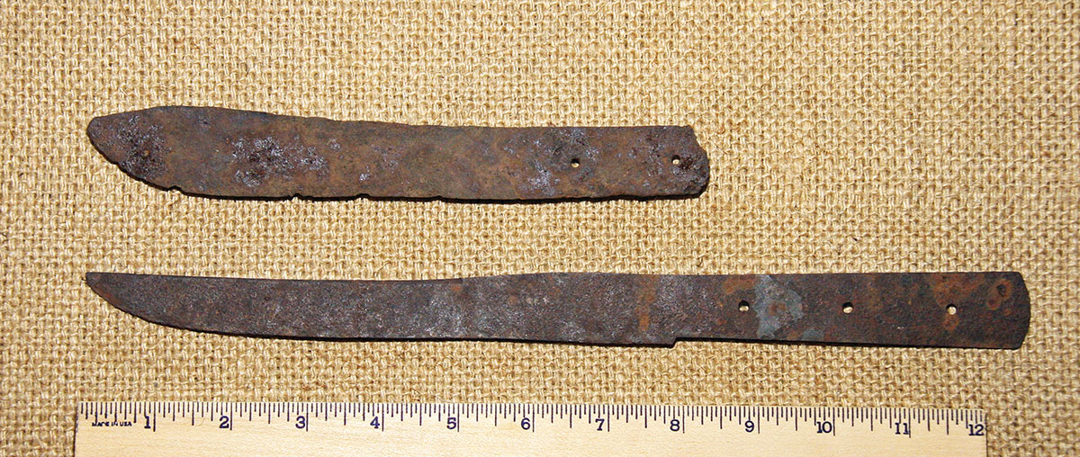Two cheaply-made belt knives found at a 1st Dragoon fort in Arizona. Historical sources would refer to these as trade knives or “scalping” knives. The top one resembles a Green River design.